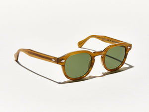 
                
                    Load image into Gallery viewer, Polished blonde acetate MOSCOT Lemtosh Sunglasses with green glass lenses side view
                
            