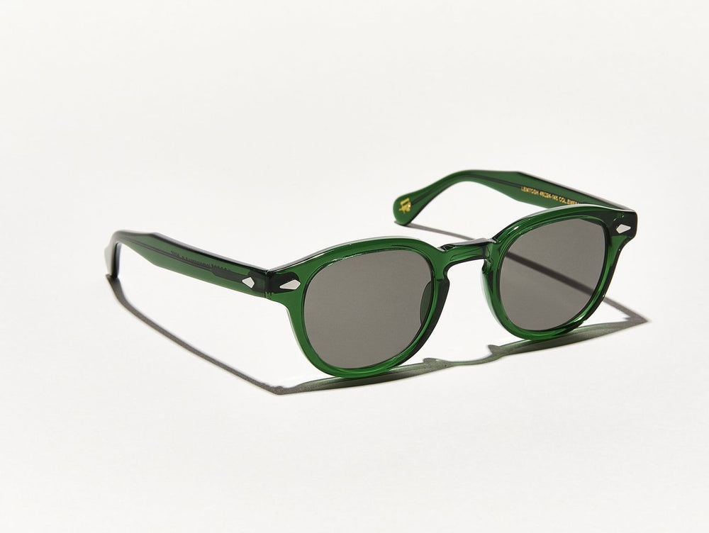 Polished semi-transparent emerald green acetate MOSCOT Lemtosh Sunglasses with grey lenses side view