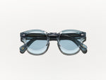 Polished light grey and blue acetate MOSCOT Lemtosh sunglasses with blue glass lenses front view