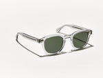 Light grey toned transparent polished acetate MOSCOT Lemtosh sunglasses with green glass sunglass lenses side view